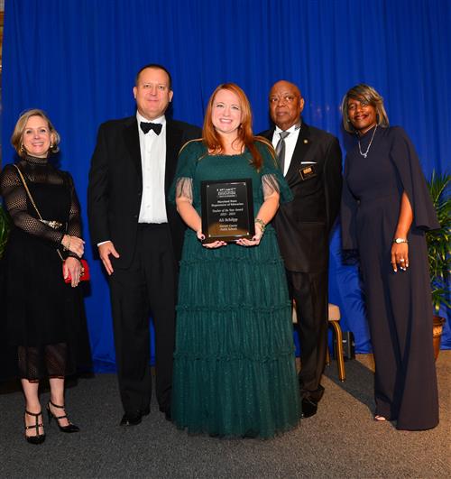 Image of Mrs. Ali Schilpp posing with MSDE reps after receiving recognition.